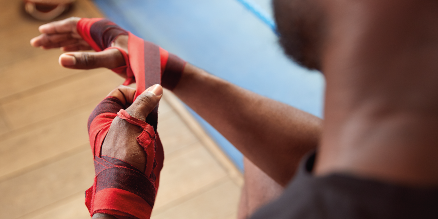 Boxer putting on Hand Wraps
