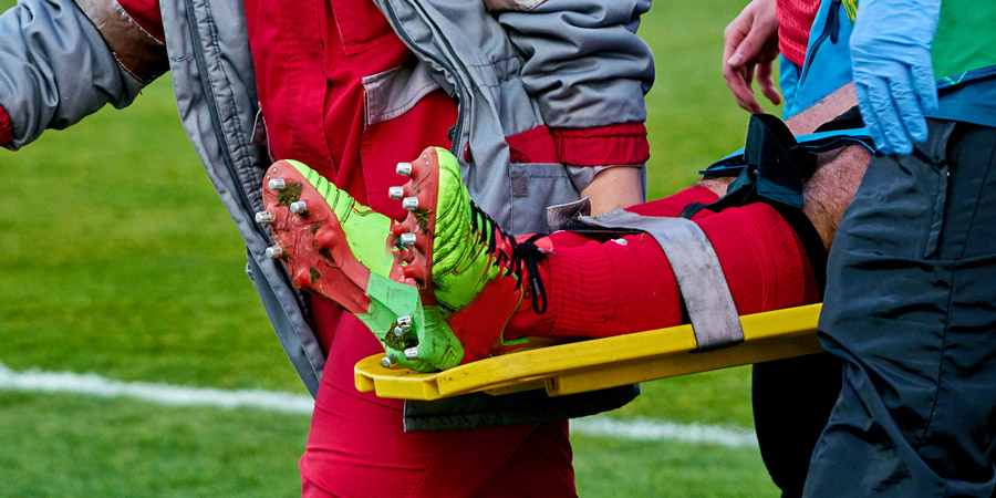 Footballer with knee brace
