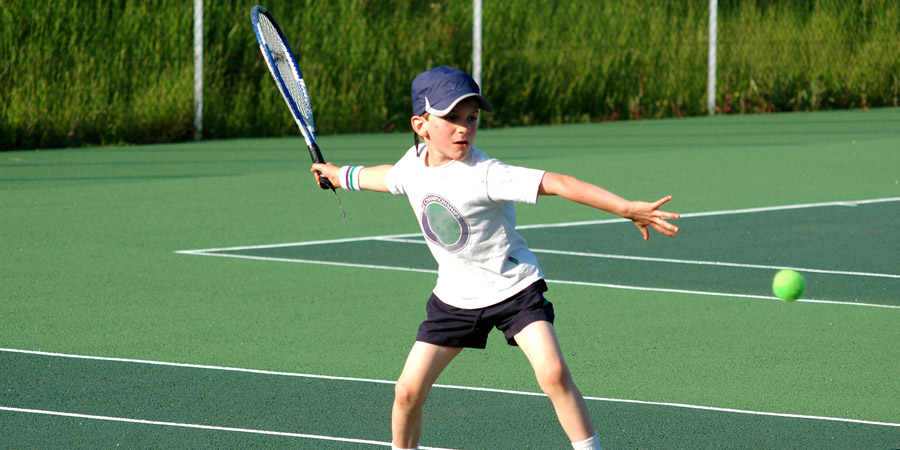 Child Playing Tennis